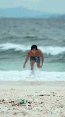 Man Dancing on Beach