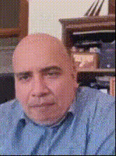 Bald Man In Blue Shirt