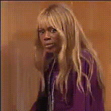 Blonde Woman In Purple Top