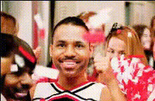 Cheerleader Smiling With Pom Poms