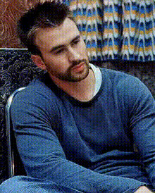 Chris Evans Sitting Relaxed