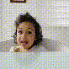 Excited Toddler Eating In Bath