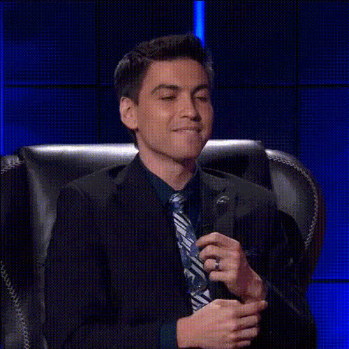 Game Show Host Smiling Proudly