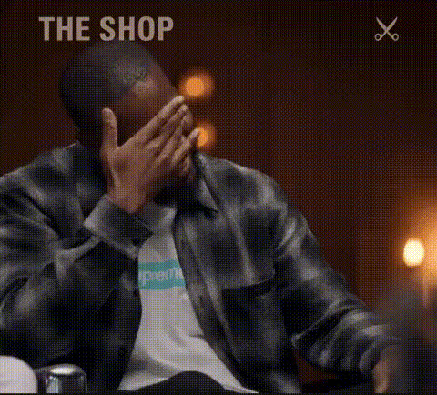Kanye West Laughing Covering Face