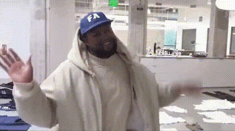 Kanye West With Hands Raised