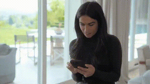 Kim Kardashian Smiling With Phone