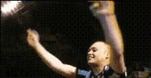 Man Celebrating In Dark Room