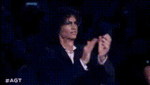 Man Clapping In Dark Room