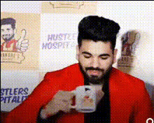 Man Drinking From A Mug
