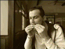 Man Eating A Sandwich
