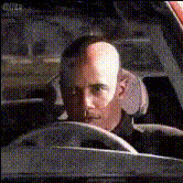 Man Driving A Car