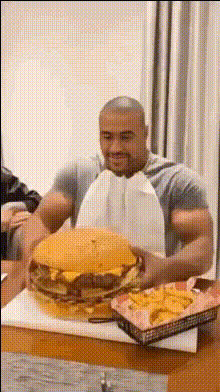 Man Eating Giant Burger