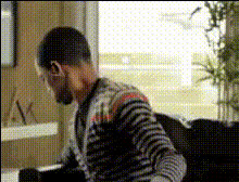 Man Eating Popcorn On Couch