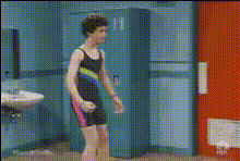 Man Flexing Muscles In Gym