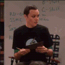 Man Holding Clipboard In Office