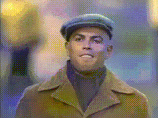 Man In Brown Coat Smiling