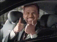 Man In Car Smiling Thumbs Up