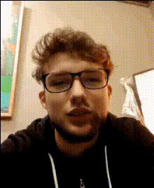 Man In Glasses Looks Camera