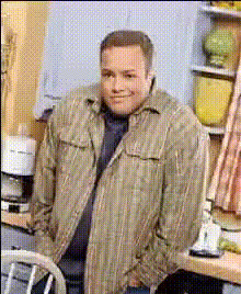 Man In Kitchen Smiling