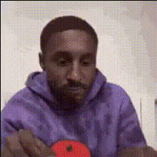 Man In Purple Hoodie
