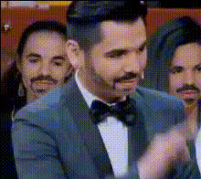 Man In Tuxedo Gestures