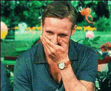 Man Laughing Covers Mouth