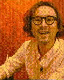 Man Laughing In Pink Shirt