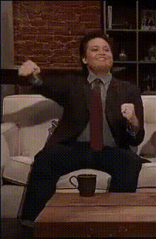 Man On Couch Celebrating
