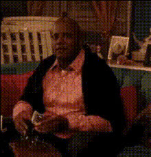 Man On Couch Gesturing