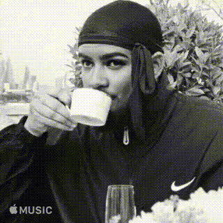 Man Sipping A Drink