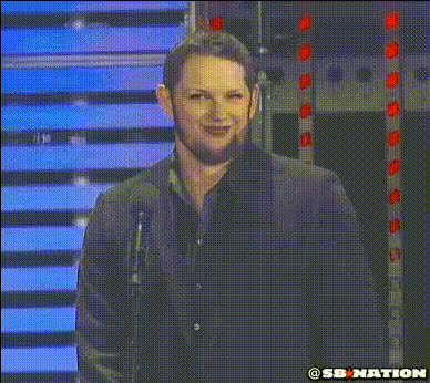 Man Smiling At Microphone