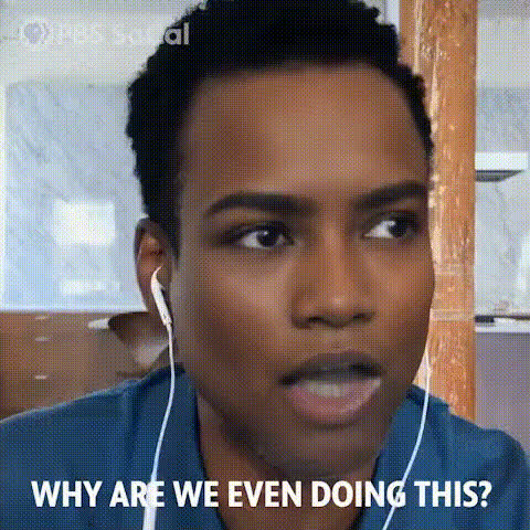 Man With Earbuds Looking Frustrated