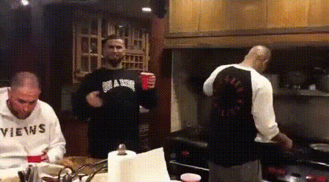 Men Drinking In Kitchen
