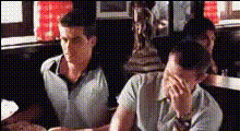 Men Sitting At Restaurant Table