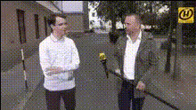 Men Talking On Street