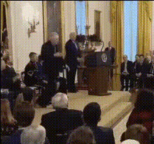 Obama Speaking At A Podium