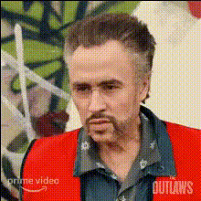 Older Man In Red Vest