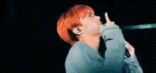 red-haired-person-pointing-up