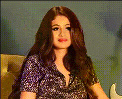 selena-gomez-smiling-sitting