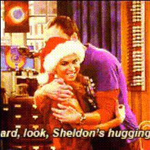 sheldon-hugs-woman-in-studio