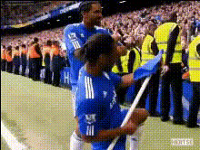 soccer-player-with-blue-flag