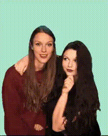two-women-posing-together-smiling