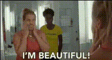 woman-admires-herself-in-mirror