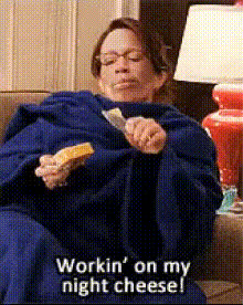 woman-eating-cheese-on-couch
