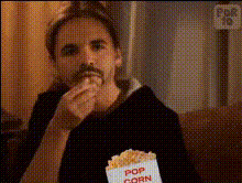 woman-eating-popcorn-on-couch