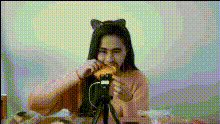 woman-eating-sandwich-with-cat-ears
