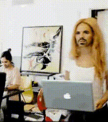 woman-holding-apple-laptop