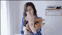 woman-holding-fluffy-dog