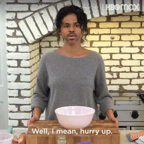 woman-in-kitchen-gesturing