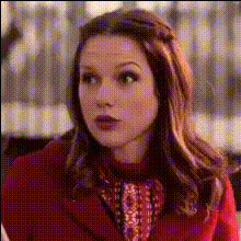 woman-in-red-coat-reacts